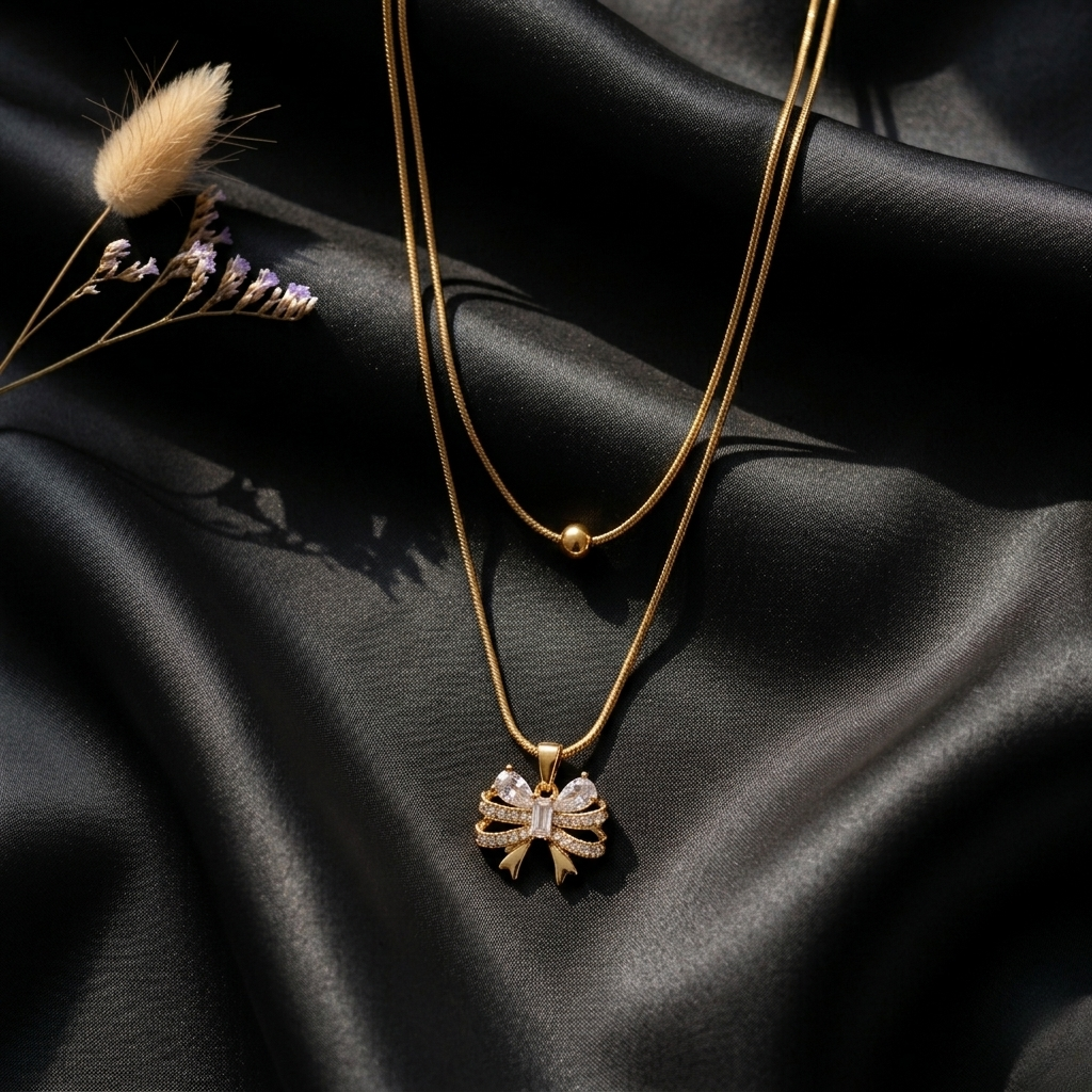 Golden Whisper Bow Pendant
